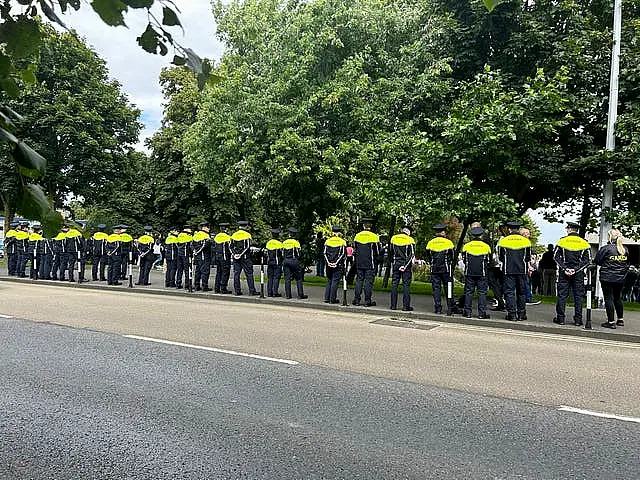 A Garda guard of honour as the coffin of Detective Garda Deirdre (Dee) Finn is carried into St John the Evangelist church in Ballinteer, Co Dublin