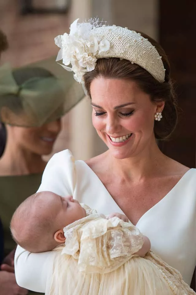 The Duchess of Cambridge carries Prince Louis as they arrive for his christening service at the Chapel Royal, St James’s Palace