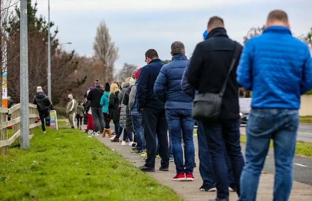 People queue outside a Covid-19 booster walk-in clinic at a centre in Greystones, Co Wicklow