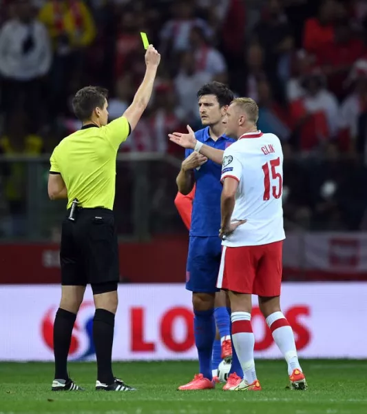 England's Harry Maguire and Poland's Kamil Glik were booked for unsporting behaviour