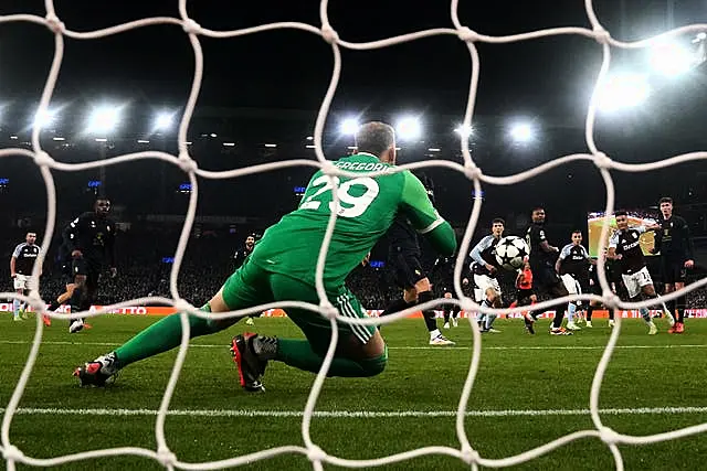 Ollie Watkins attempts a shot on goal which is saved by Juventus goalkeeper Michele Di Gregorio