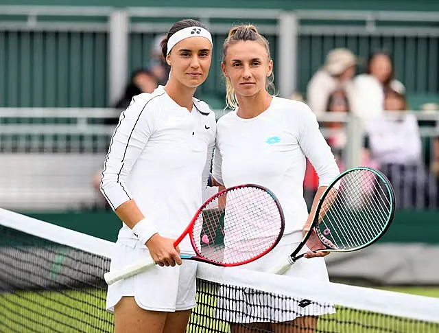 Anhelina Kalinina, left, and Lesia Tsurenko, right, before the match