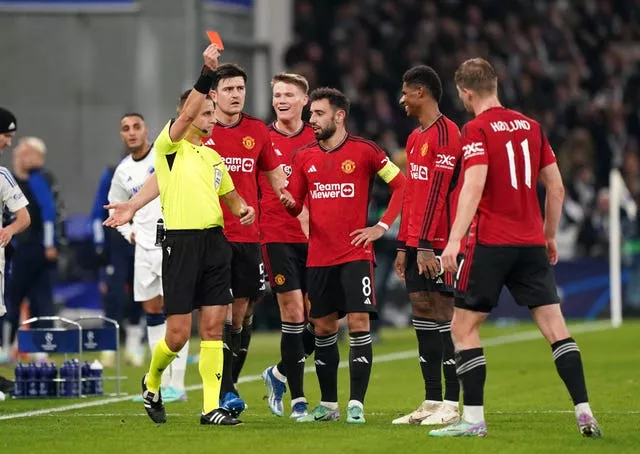 Manchester United’s Marcus Rashford (second right) is shown a red card
