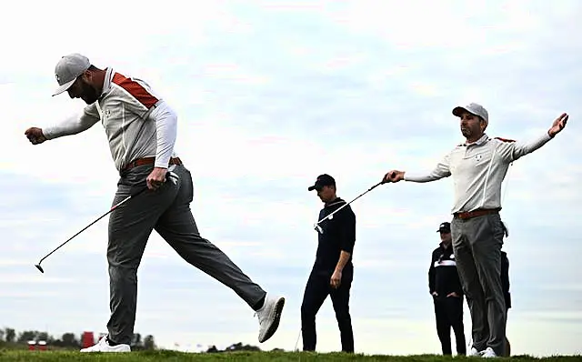 Jon Rahm and Sergio Garcia celebrate