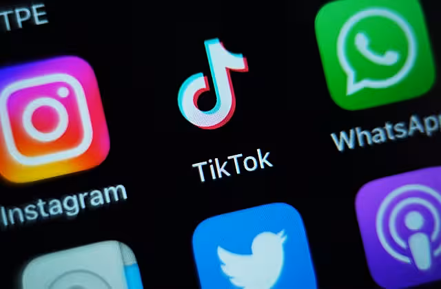 The TikTok app among other social media apps shown on a smartphone screen