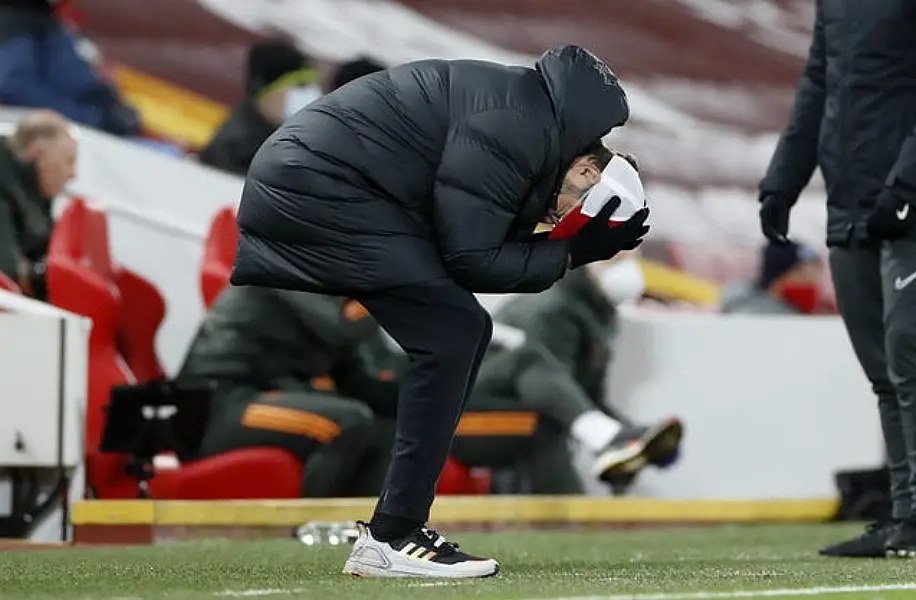 Liverpool manager Jurgen Klopp holds his head in his hands