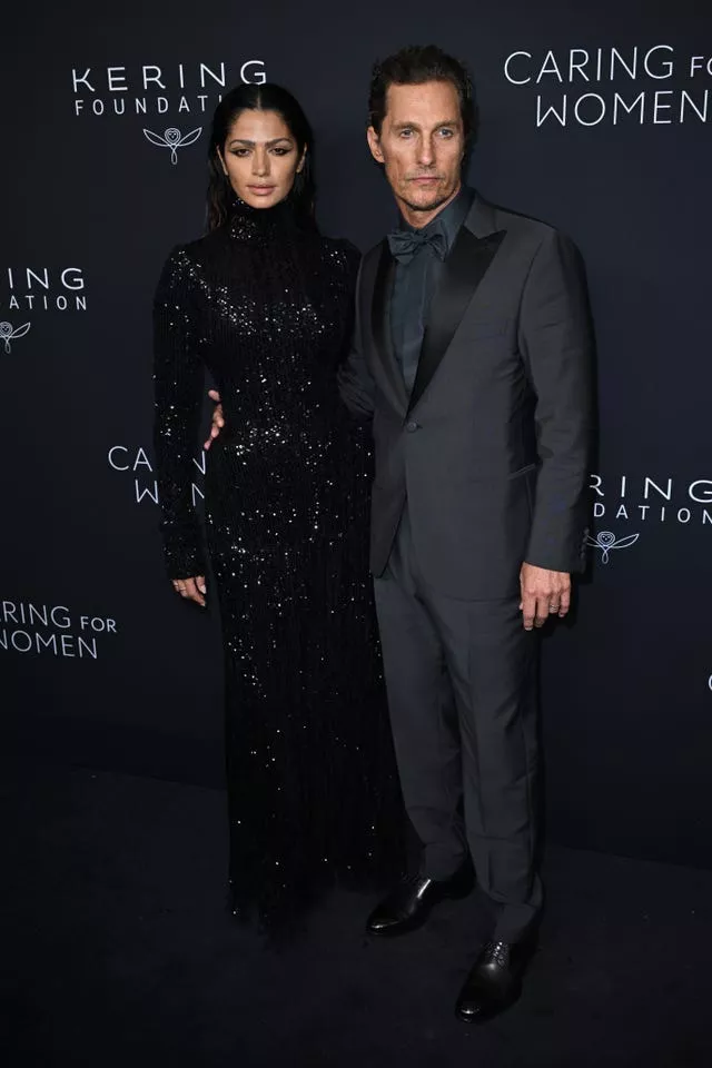 Camila Alves McConaughey (left) and Matthew McConaughey pose on red carpet for Kering Foundation’s Caring for Women dinner