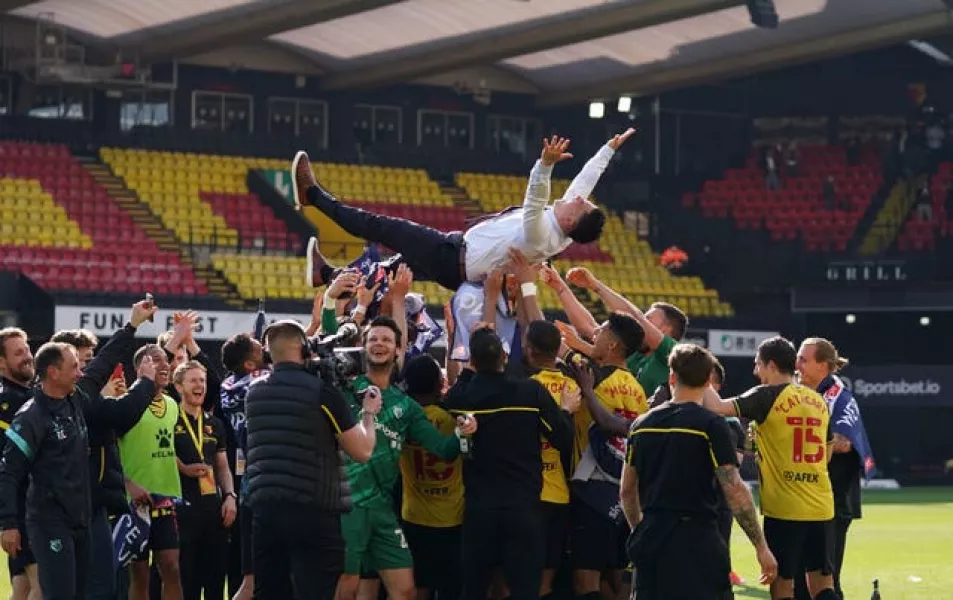 Watford head coach Xisco Munoz is thrown into the air by his players after guiding the club back into the Premier League at the first attempt