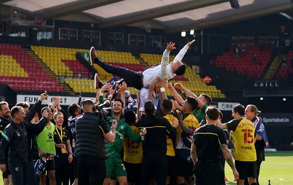 Watford head coach Xisco Munoz is thrown into the air by his players after guiding the club back into the Premier League at the first attempt