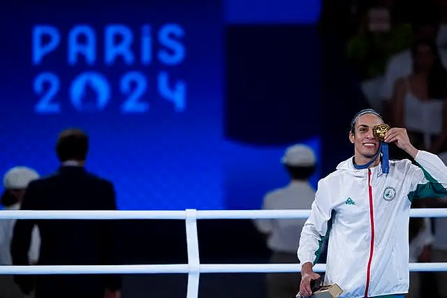 Gold nedallst Imane Khelif on the podium for the women's 66kg at Roland Garros Stadium on day 14 of the 2024 Paris Olympics