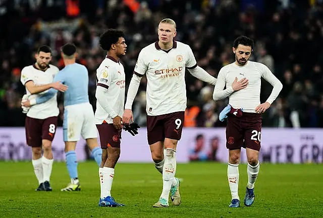 Manchester City players appear dejected after defeat at Aston Villa