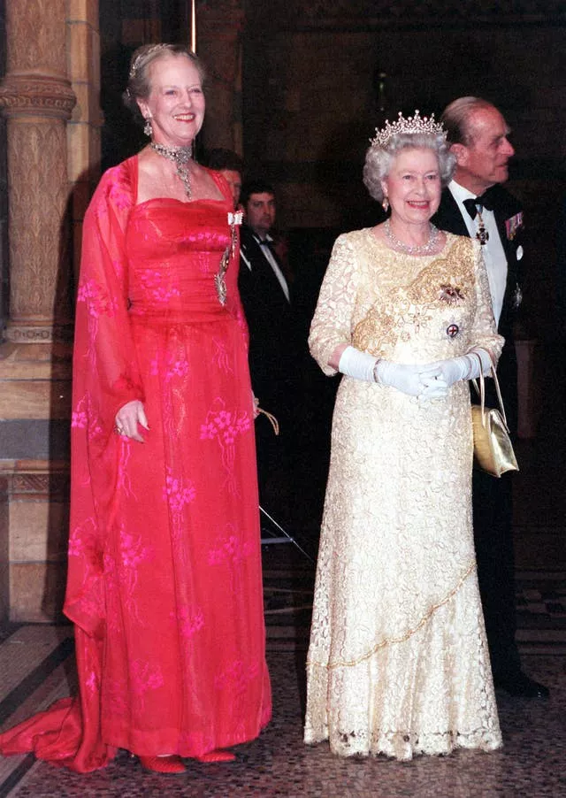 Queen Margrethe of Denmark and Britain’s Queen Elizabeth II welcome guests invited to a reception hosted by Queen Margrethe at the Natural History Museum 