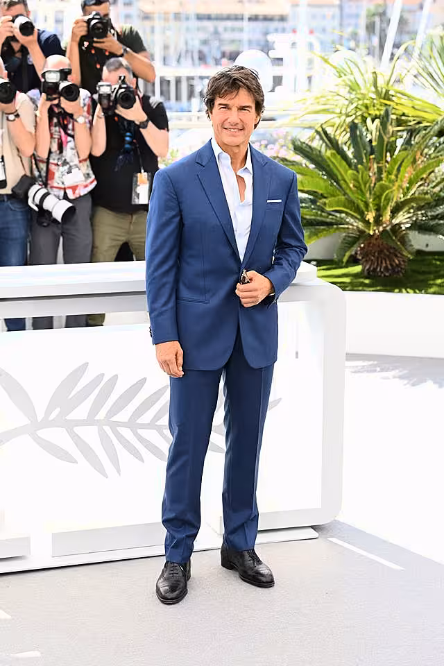 Tom Cruise poses at a photocall for Top Gun: Maverick