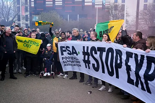 Manchester United fans protest ticket pricing ahead of the Premier League match at Old Trafford