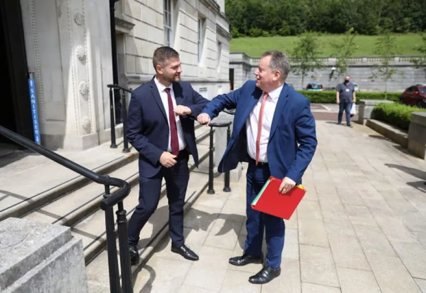 Colin McGrath from the SDLP and chairman of the Executive Office Committee greets Brexit minister Lord Frost