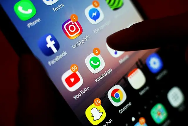 The icons of social media apps, including Facebook, Instagram, YouTube and WhatsApp, are displayed on a mobile phone screen, in London. 