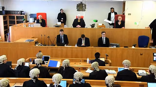 Sir Geoffrey Vos, the Lord Chief Justice Lord Burnett, and Lord Justice Underhill (seated top, left to right) in the Court of Appeal to deliver their ruling (Cameras in Court/PA)