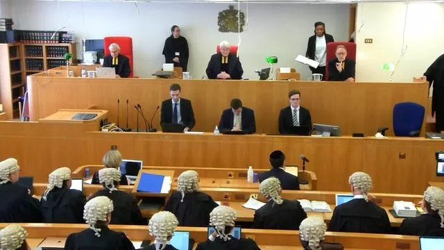 Sir Geoffrey Vos, the Lord Chief Justice Lord Burnett, and Lord Justice Underhill (seated top, left to right) in the Court of Appeal to deliver their ruling (Cameras in Court/PA)