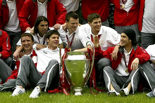 Liverpool players celebrate with the Champions League trophy in 2005