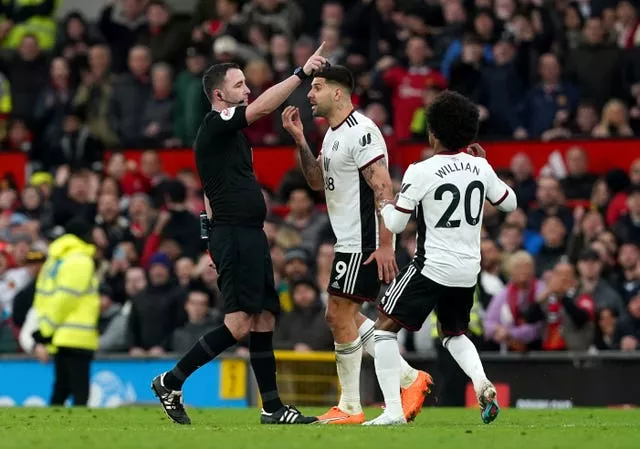 Fulham’s Aleksandar Mitrovic confronts referee Chris Kavanagh