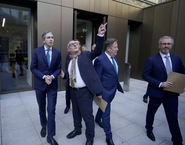 (left to right) Taoiseach Simon Harris, David McRedmond, independent chair of the Dublin City Taskforce, Housing Minister Darragh O’Brien and Minister for Children and Green Party leader Roderic O’Gorman at the General Post Office, Dublin 