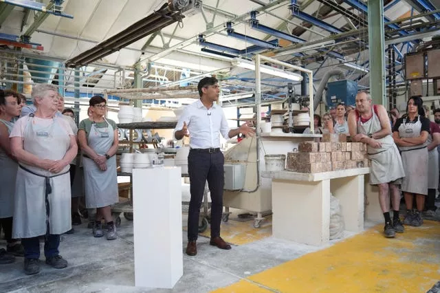 Prime Minister Rishi Sunak talking to staff during his visit to Denby Pottery Factory, Ripley