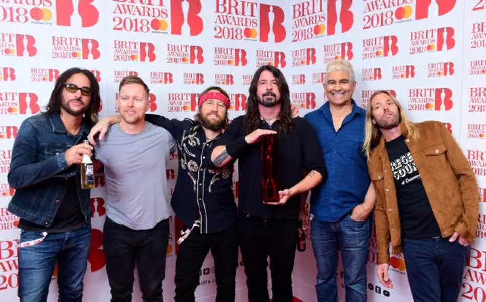 Foo Fighters with their award for Best International Group in the press room during the Brit Awards