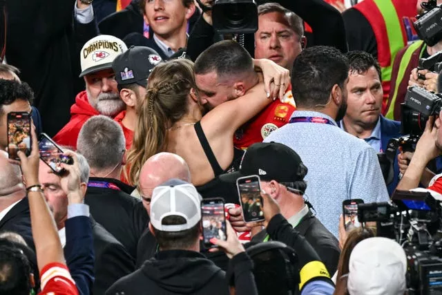 Travis Kelce with Taylor Swift following the Super Bowl victory