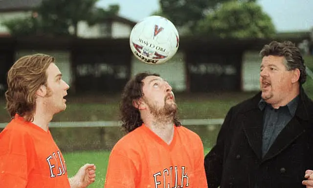 Warming up before a charity football match in aid of the Calton Athletic drugs rehabilition and prevention project are actors (l/r), Ewan McGregor, Phil Kay and Robbie Coltrane on June 11 1997