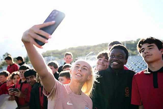 England’s Chloe Kelly stopped for photos with fans after a training session at Central Coast Stadium 