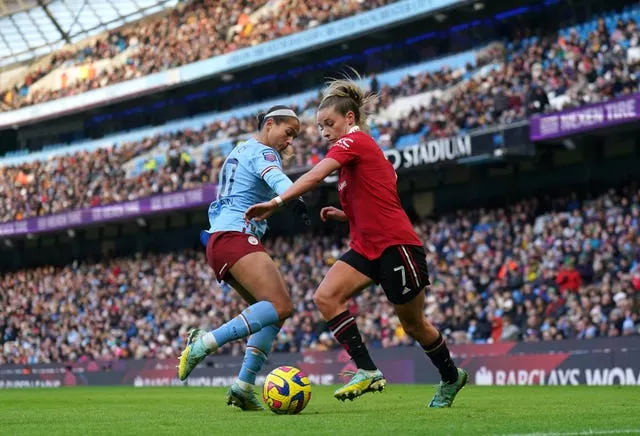 Manchester City’s Deyna Castellanos and Manchester United’s Ella Toone battle for the ball (Tim Goode/PA)