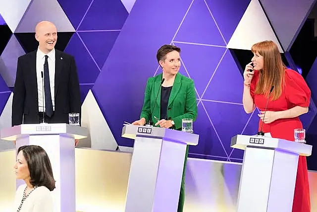 Stephen Flynn of the SNP watches as Greens co-leader Carla Denyer responds to Labour leader Angela Rayne