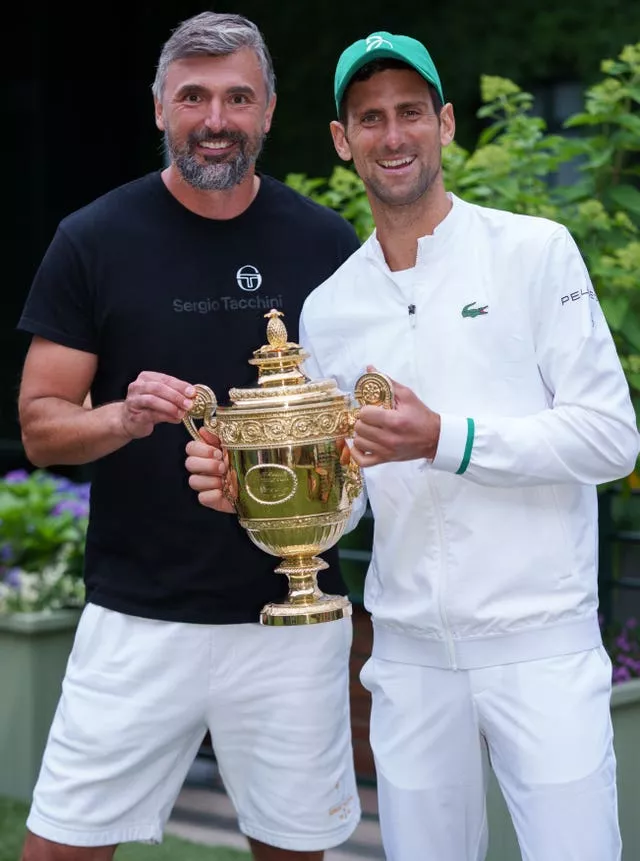Novak Djokovic, right, and Goran Ivanisevic with the Wimbledon trophy