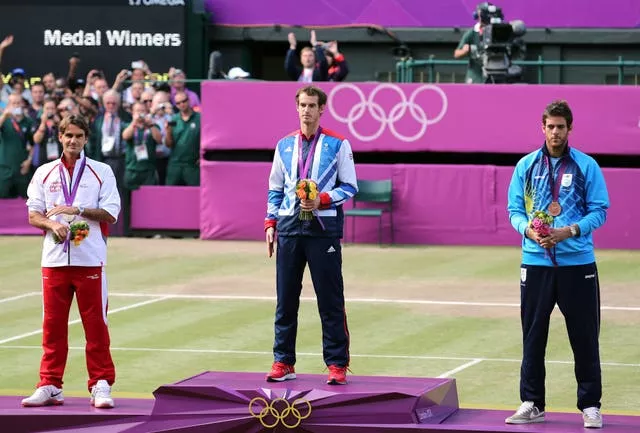 Andy Murray, centre, Roger Federer, left, and Juan Martin Del Potro on the podium at Wimbledon