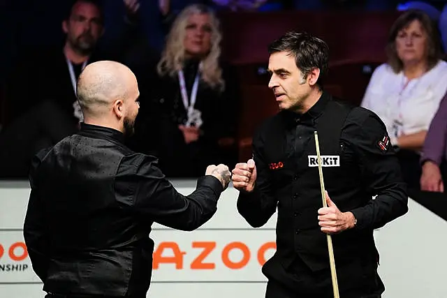 Ronnie O’Sullivan congratulates Luca Brecel (left) after their World Championship quarter-final