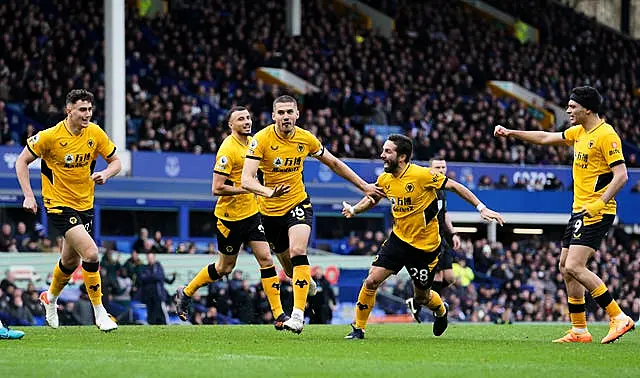 Conor Coady, centre, celebrates scoring Wolves' winner at Everton