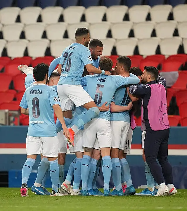 Manchester City celebrate scoring against PSG