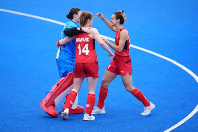 Tess Howard, middle, and her team-mate wearing shorts during a game. 