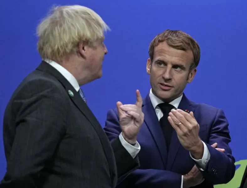 Boris Johnson greets French President Emmanuel Macron at the Cop26 summit in Glasgow 