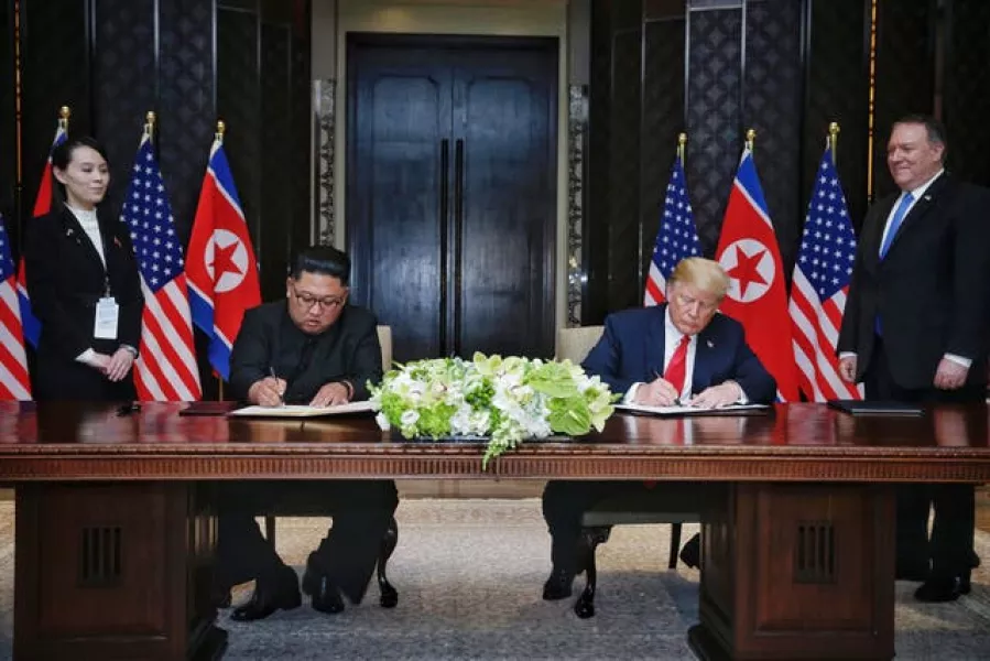 The US–North Korea summit signing ceremony in Singapore (Kevin Lim/The Straits Times/PA)