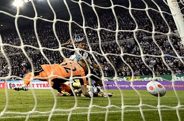 Arsenal’s Ben White turns the ball into his own net for the opening goal at Newcastle
