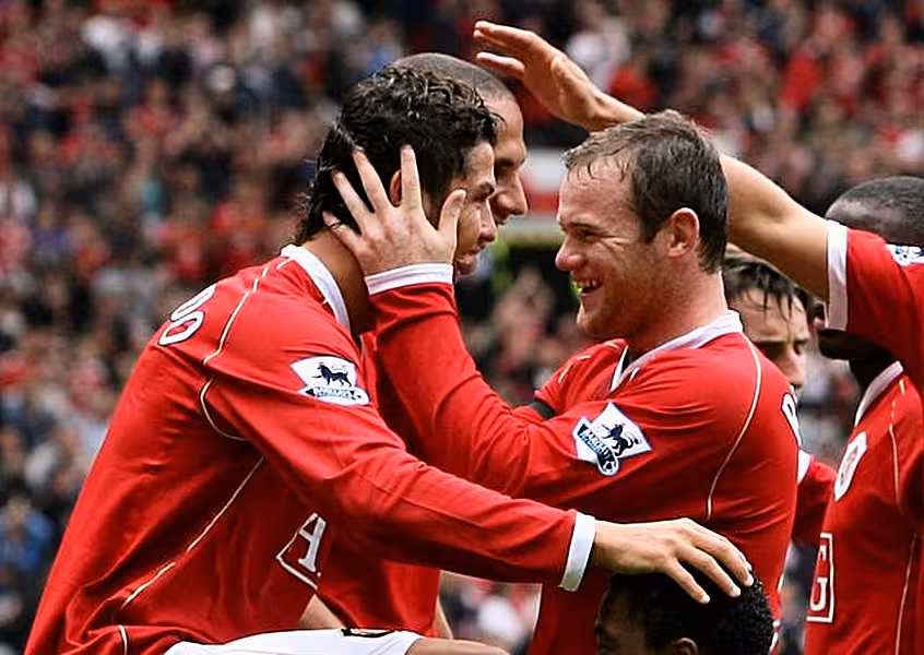 Cristiano Ronaldo (left) and Wayne Rooney (right) played together at Manchester United from 2004 to 2009 (Peter Byrne/PA).