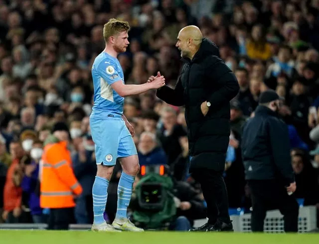 Guardiola (right) feels De Bruyne (left) would suit the role