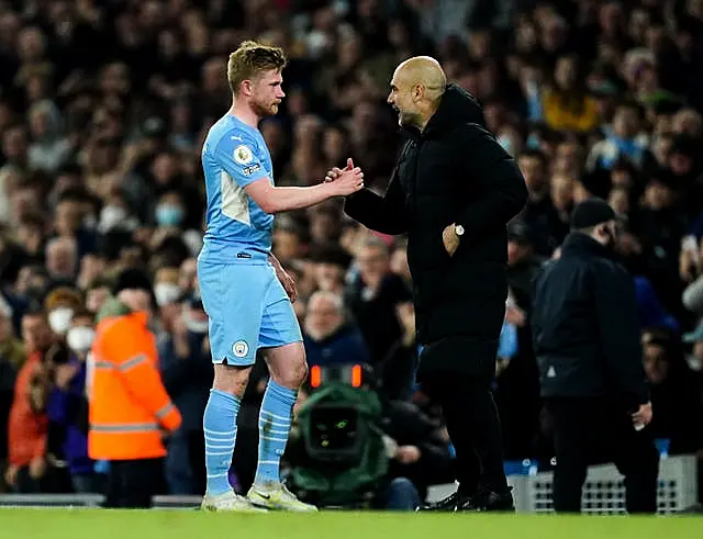 Guardiola (right) feels De Bruyne (left) would suit the role