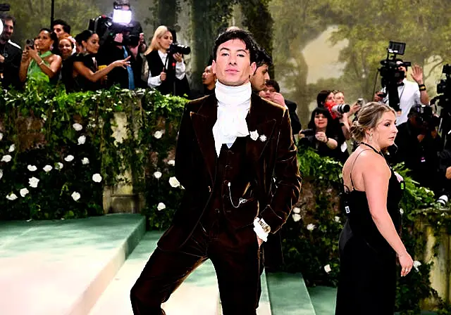 Barry Keoghan in a velvety burgundy jacket and ruff collar at the Met Gala 