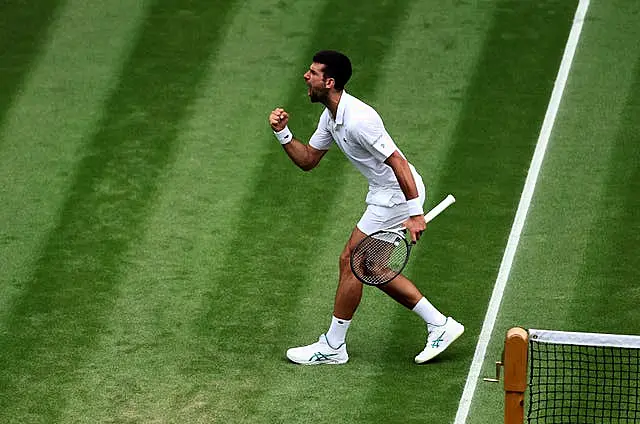 Novak Djokovic clenches his fist after winning the third set