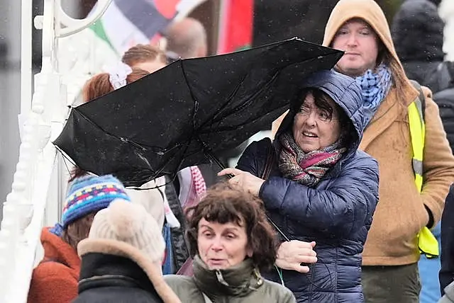 A person struggles with their umbrella as the wind picks up in Dublin’s city centre