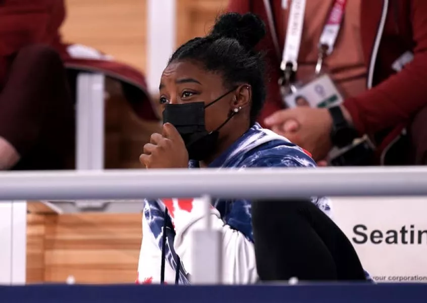 Simone Biles watches the Olympic gymnastics action in Tokyo