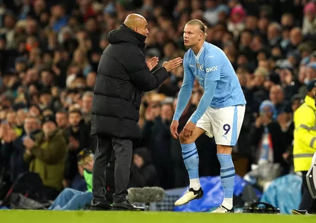 Pep Guardiola, left, leapt to the defence of Erling Haaland (Martin Rickett/PA)