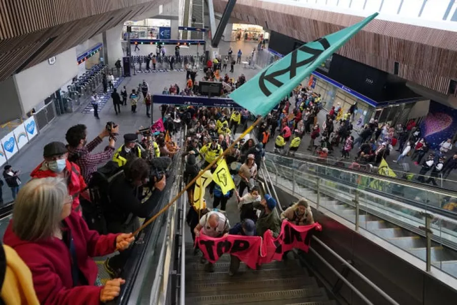 Demonstrators inside London Bridge station (Ian West/PA)
